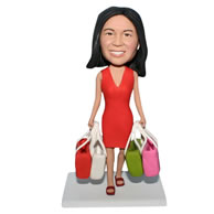 Red dress woman handing with multi shopping bags bobblehead